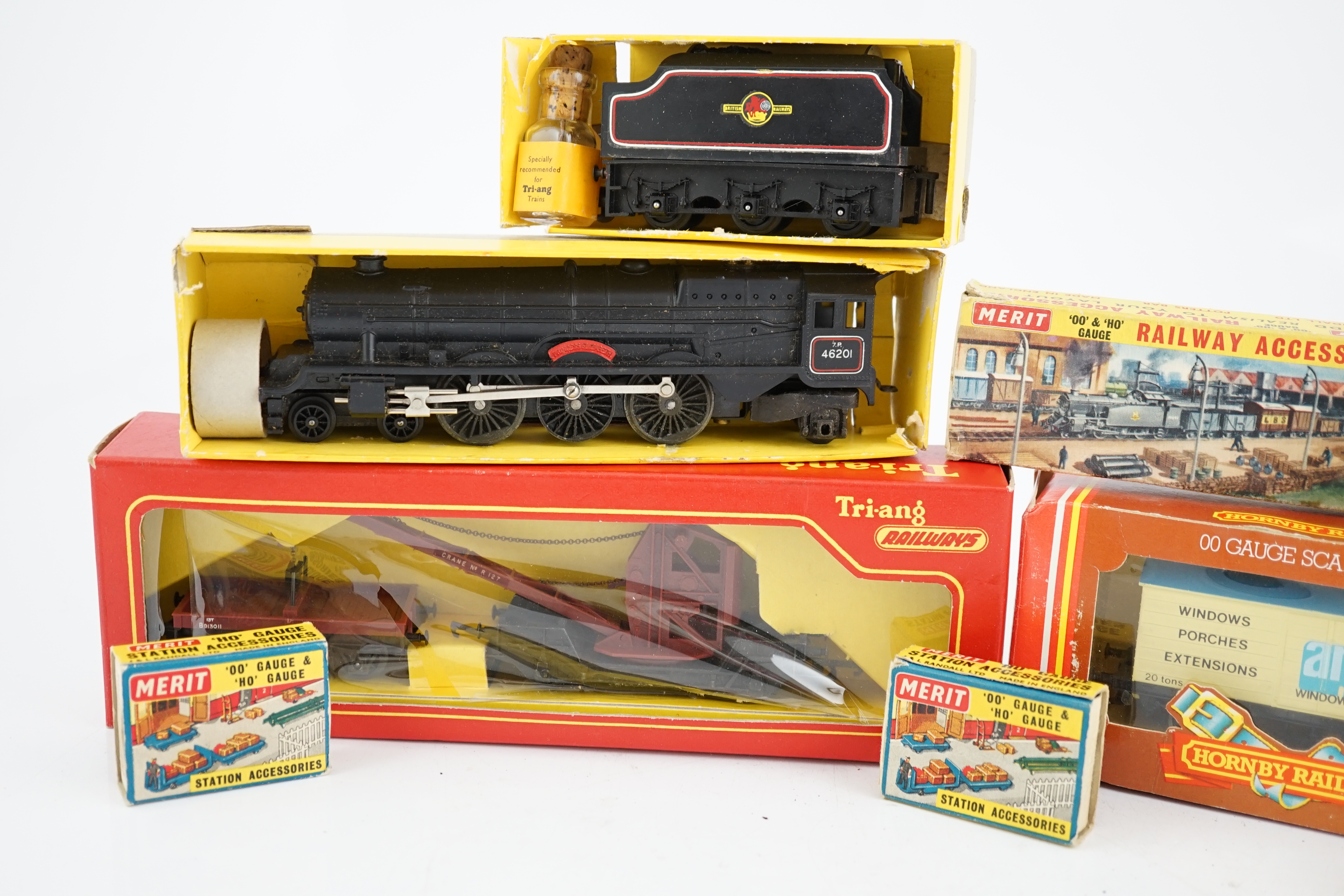 A collection of mostly Tri-ang Railways 00 gauge model railway, including three locomotives; a BR saddle tank loco (R153), a BR Princess Royal class 4-6-0 and an S.R. Suburban Motor Coach driving unit